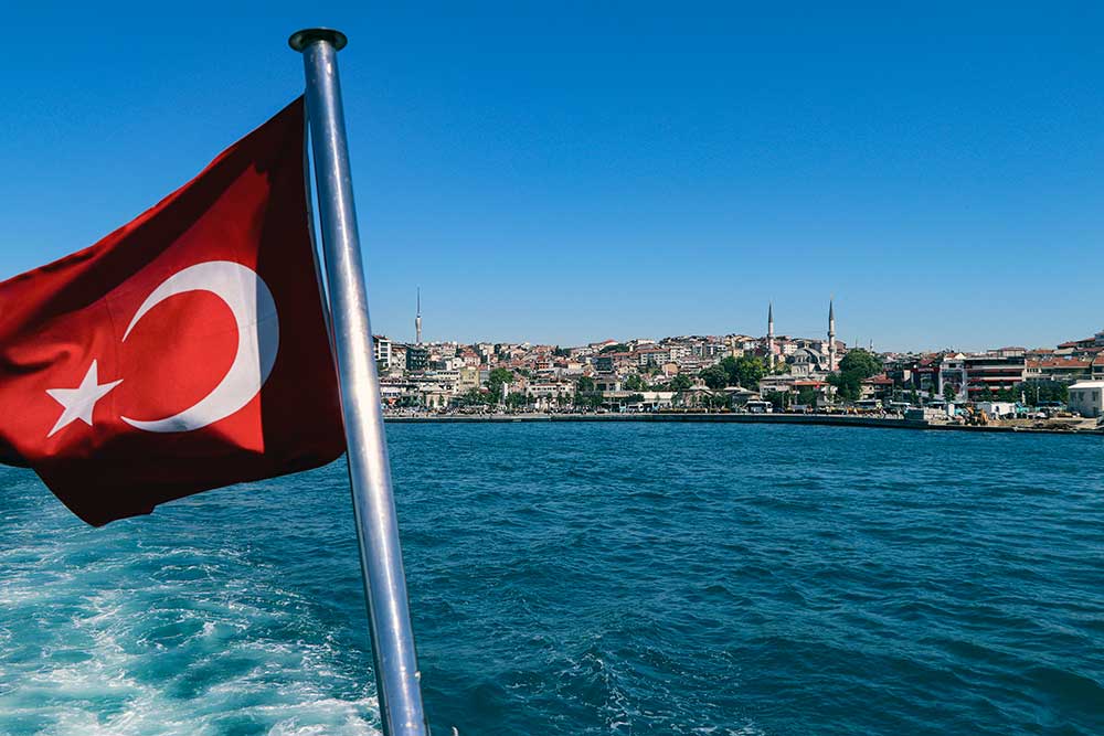 Boat on Bosphorus with Turkish Flag